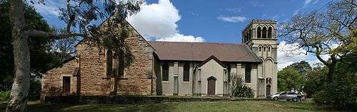 Panoramic photograph of the northern side of St John's in full sun.