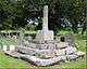 A square stone base of three steps topped with a stone and part of the shaft of a now missing cross