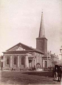 An elegant church in the Georgian style with a spire