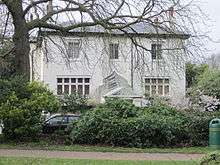 Early Victorian house seen from a park.