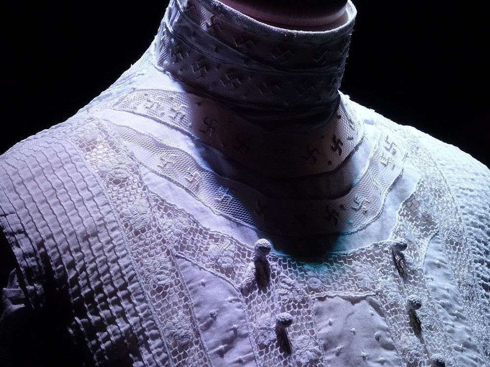 Swastikas on the wedding dress as symbols of luck, British colony, 1910