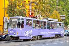 Purple tramcar with Milka cursive logo