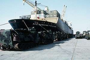 The front of a container ship, as viewed from a dock