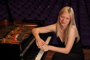 Valentina Lisitsa beside a piano