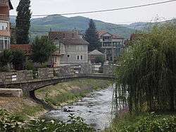 Bridge over a small river flowing through a town