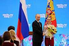 Olga Graf is congratulated by Russian President Vladimir Putin.