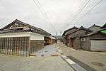 Wooden and black tile-roofed ship-owner houses.