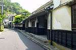 Small street lined by wooden houses.